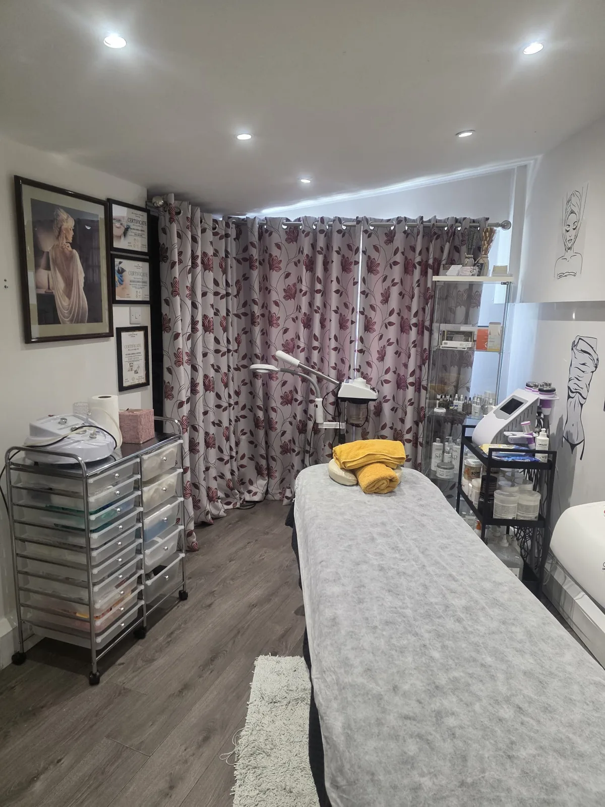 Treatment room with a facial steamer and curtains